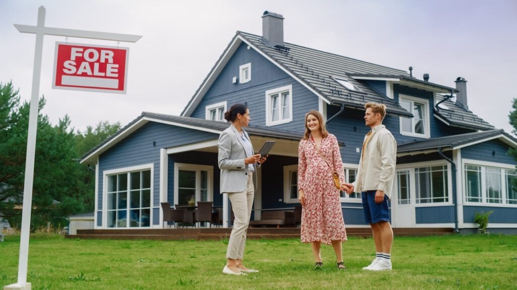 A couple and a real estate agent buying a home.
