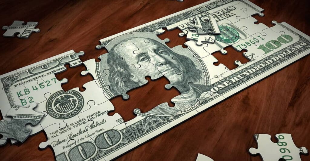 Puzzle to put together a $100 bill on your way to figuring out how to save $10,000 in a year