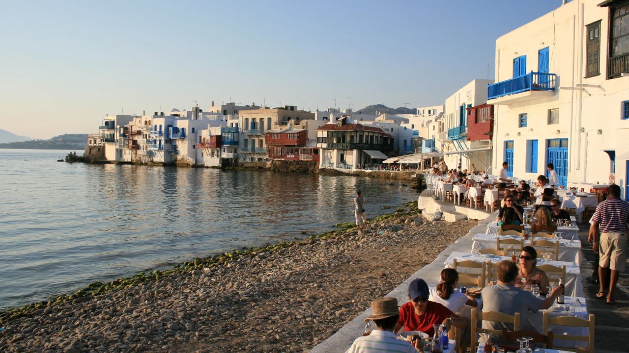 Diners on the beach in Little Venice of Mykonos, Greece