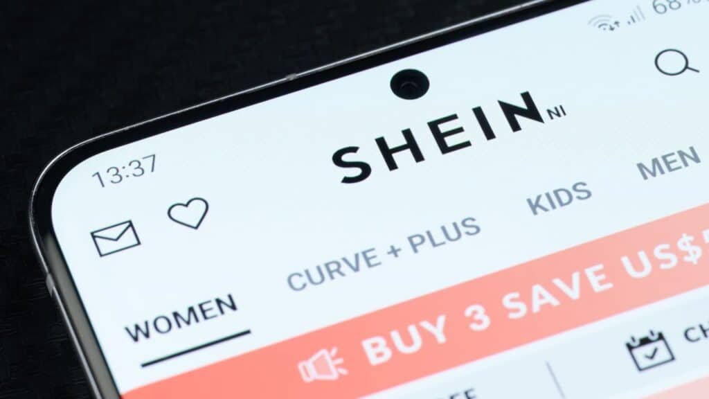 New york, USA - May 5, 2022: Buying on shein online shop app on smartphone screen close up view