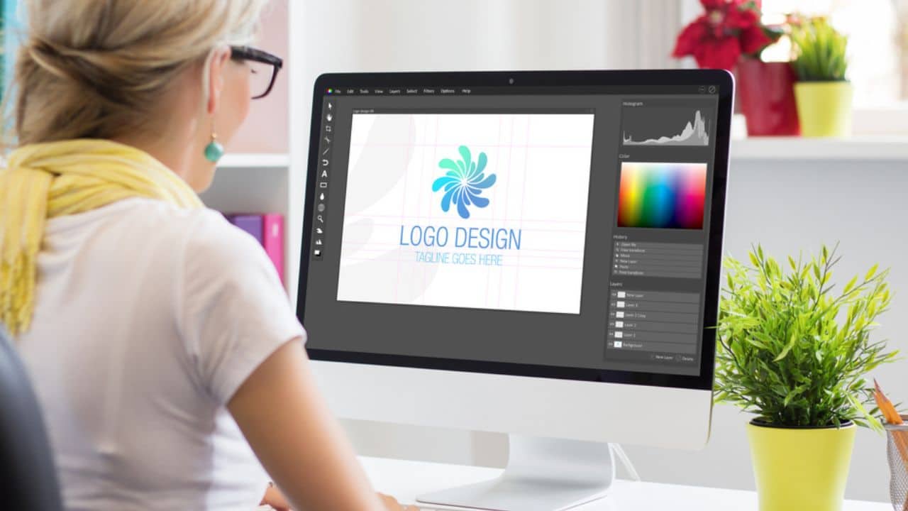 Graphic designer creating logo on computer